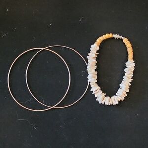 Two metal bracelets & one shell bracelet